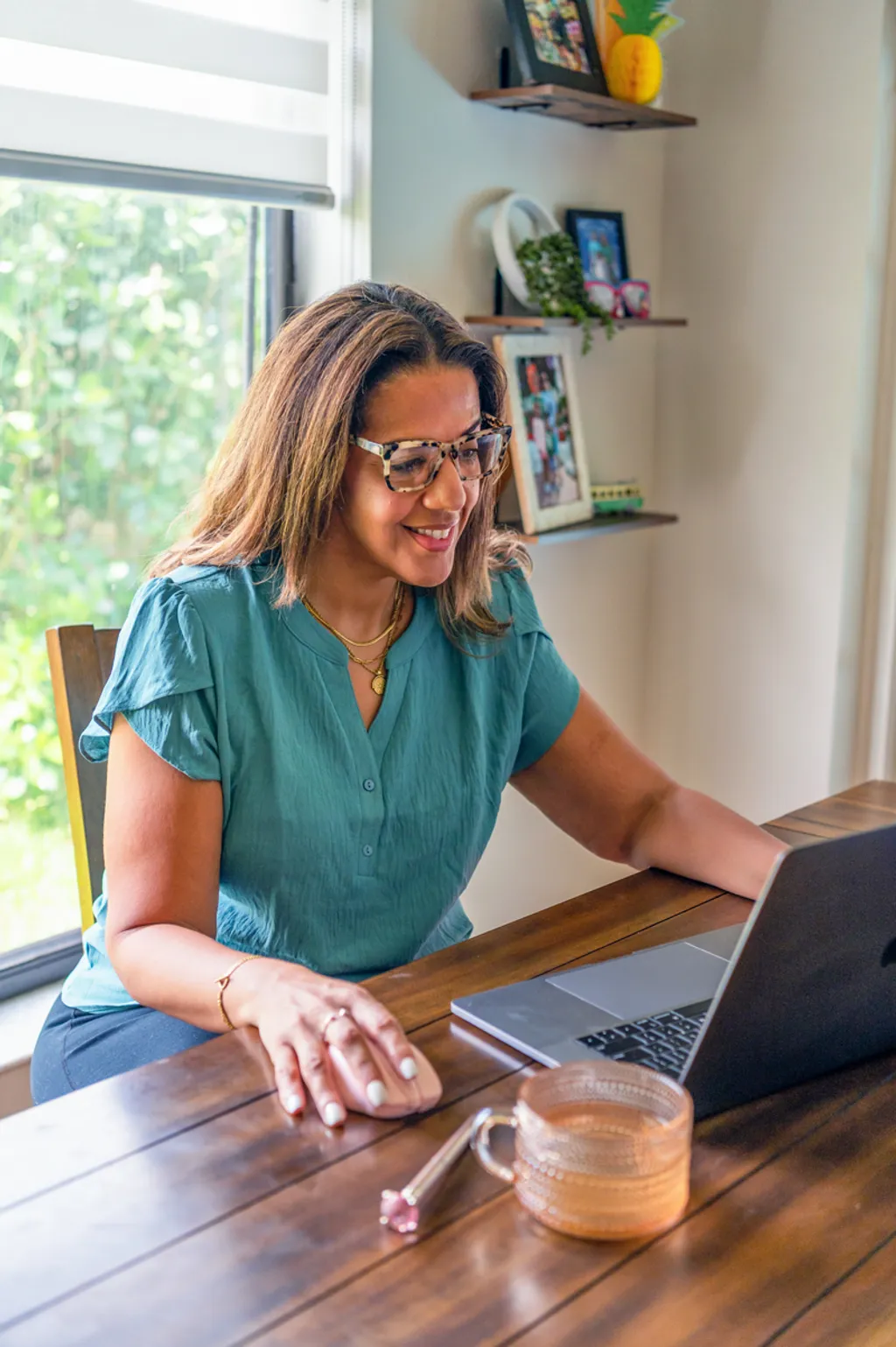 Sherly Millan at laptop — virtual EMDR therapy